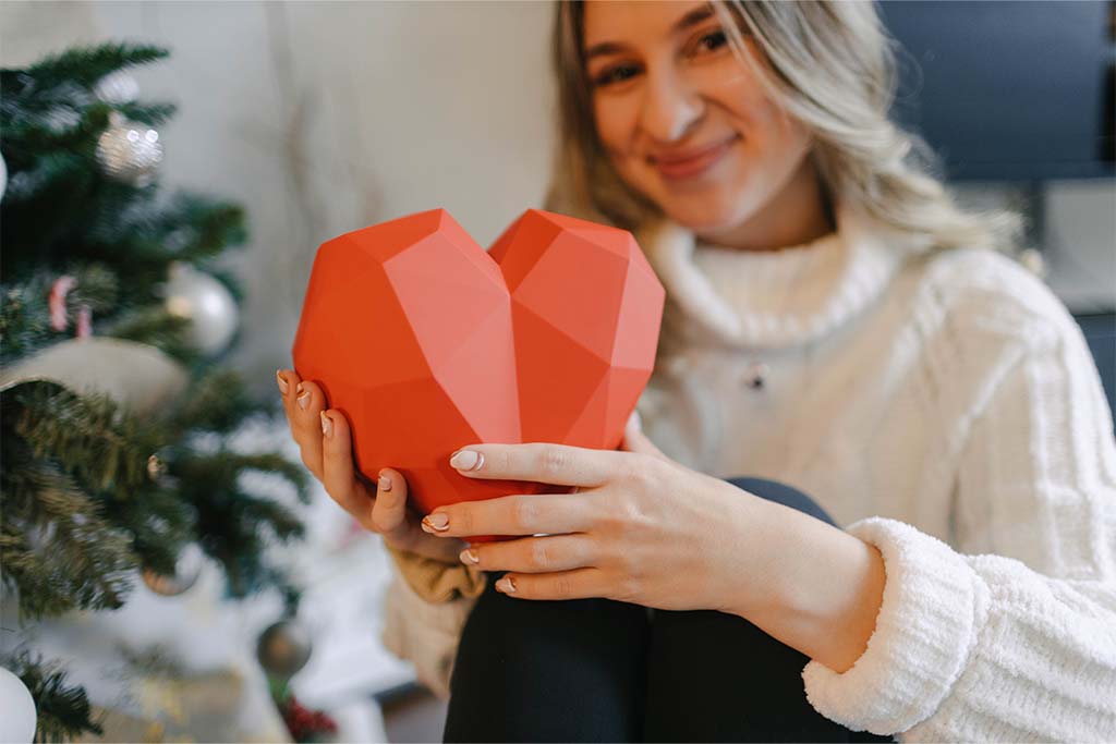 A girlfriend holding her romantic anniversary gift